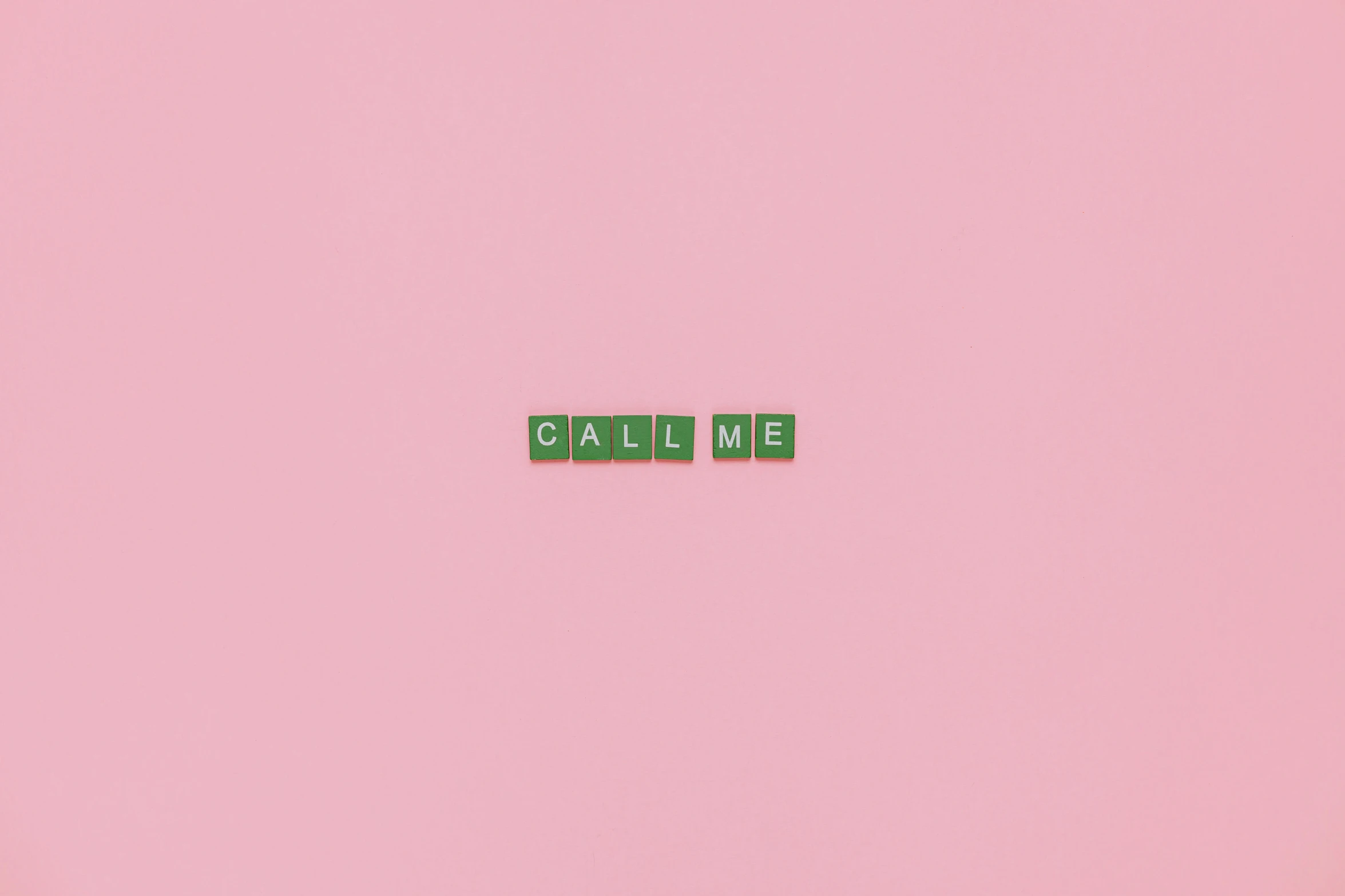 wooden blocks spelling call me on a pink background, an album cover, inspired by Carrie Mae Weems, tumblr, conceptual art, pastel green, tileable, telephone, calm weather