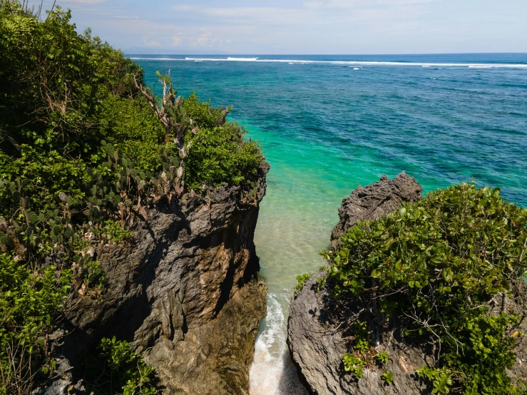 a view of the ocean from the top of a cliff, sumatraism, turquoise water, carson ellis, archipelago, nature photo