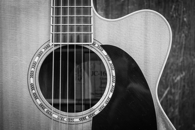 a black and white photo of a guitar, by Jim Manley, pixabay, precisionism, fan favorite, all enclosed in a circle, portrait of a big, acoustic information