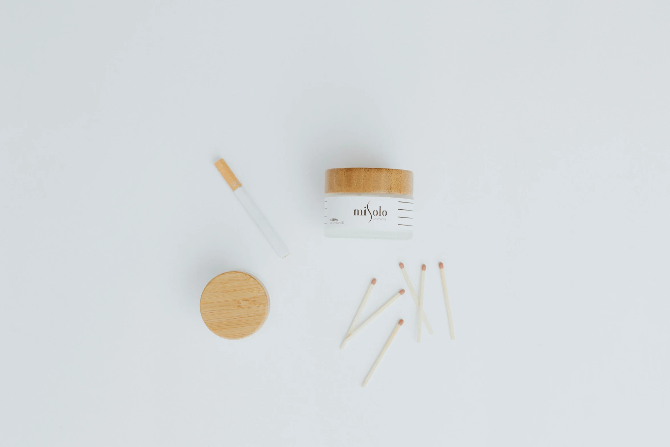 a jar of cream sitting on top of a white table, a picture, unsplash, dau-al-set, small quills along it's back, mikado, photo taken with provia, high resolution product photo