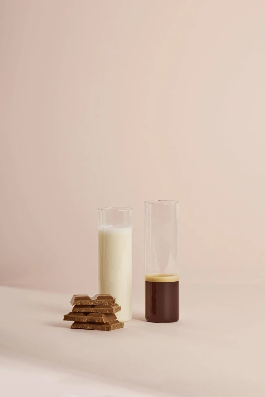 a glass of milk and some cookies on a table, inspired by Giorgio Morandi, unsplash, conceptual art, clemens ascher, dwell, dark brown, high resolution product photo