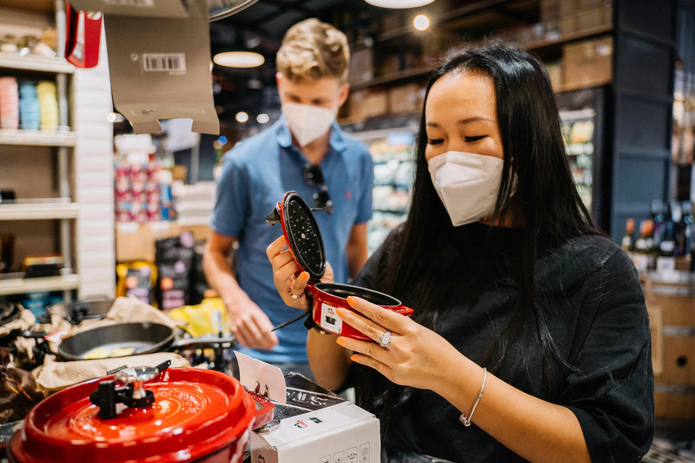 a woman in a face mask looking at a cell phone, by Julia Pishtar, pexels contest winner, hyperrealism, fresh food market people, manuka, wide angle shot, avatar image