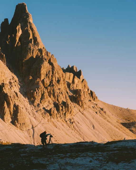 a couple of people standing on top of a mountain, asymmetrical spires, late afternoon light, climbing, trending photo