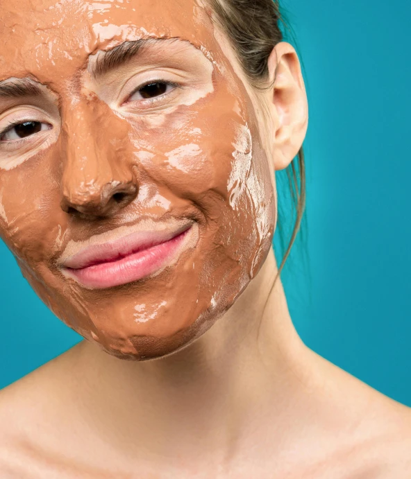 a woman with a mud mask on her face, by Olivia Peguero, shutterstock, antipodeans, wearing a brown, candy treatments, thumbnail, normal face