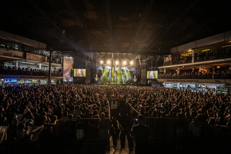 a large crowd of people at a concert, a picture, by Robbie Trevino, manila, megadeth, 3 / 4 wide shot, malika favre