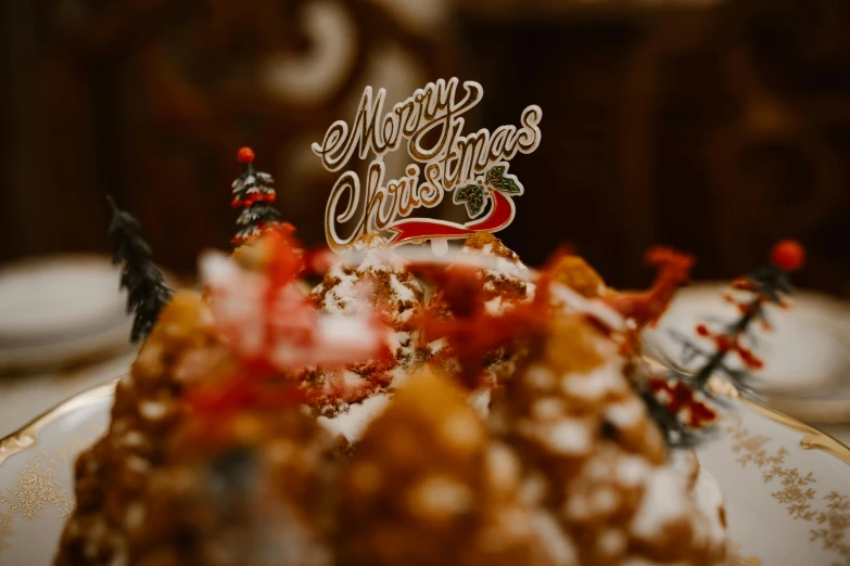 a piece of cake sitting on top of a plate, a tilt shift photo, pexels, graffiti, christmas, background image, merry, the best ever