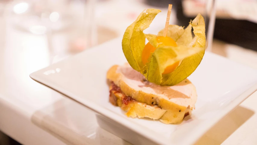 a close up of a plate of food on a table, renaissance, pointè pose, square, stuffed, ham