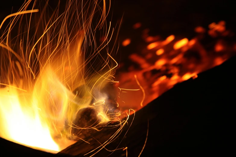 a close up of a fire with sparks coming out of it, pexels contest winner, relaxing, metalwork, avatar image, volcanic workshop background