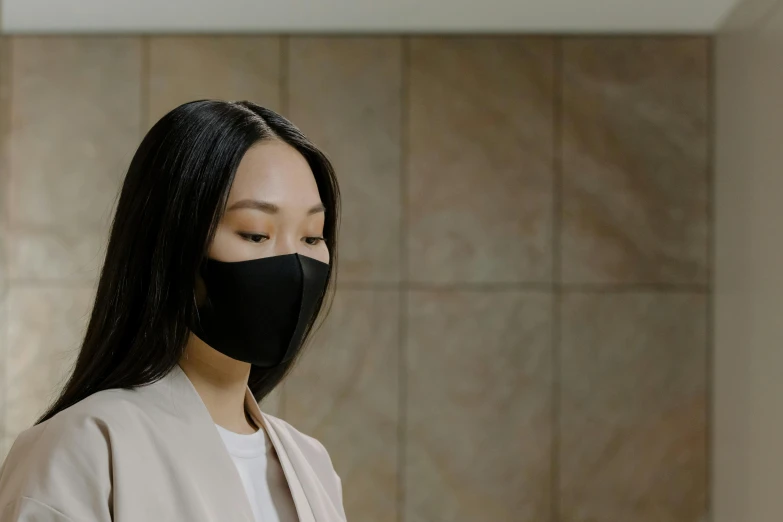 a woman wearing a black face mask in a bathroom, inspired by Kanō Hōgai, renaissance, walking to work, silicone skin, without text, korean