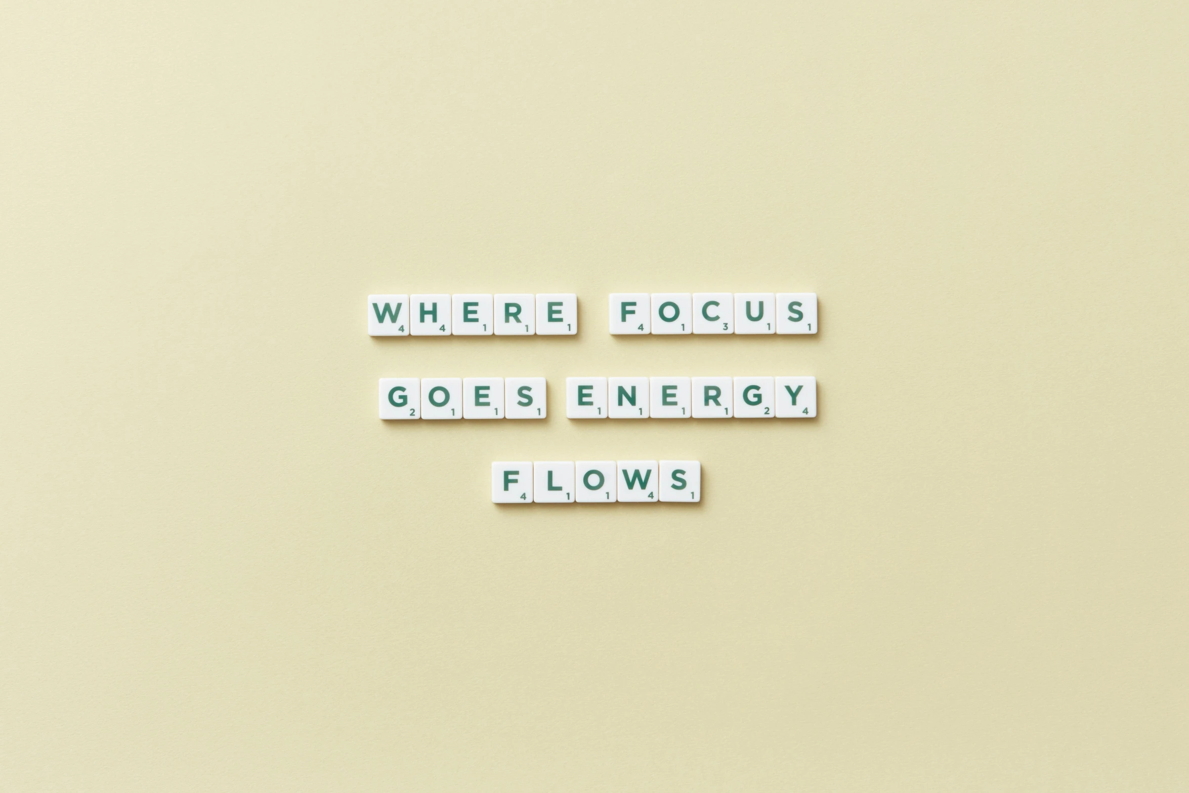 a sign that says where focus goes energy flows, pexels contest winner, visual art, passive house, puzzling, mars energy, flatlay