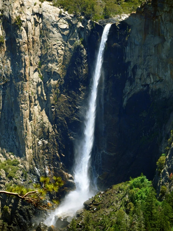 a large waterfall in the middle of a forest, yosemite valley, zoomed out to show entire image, slide show, highly upvoted