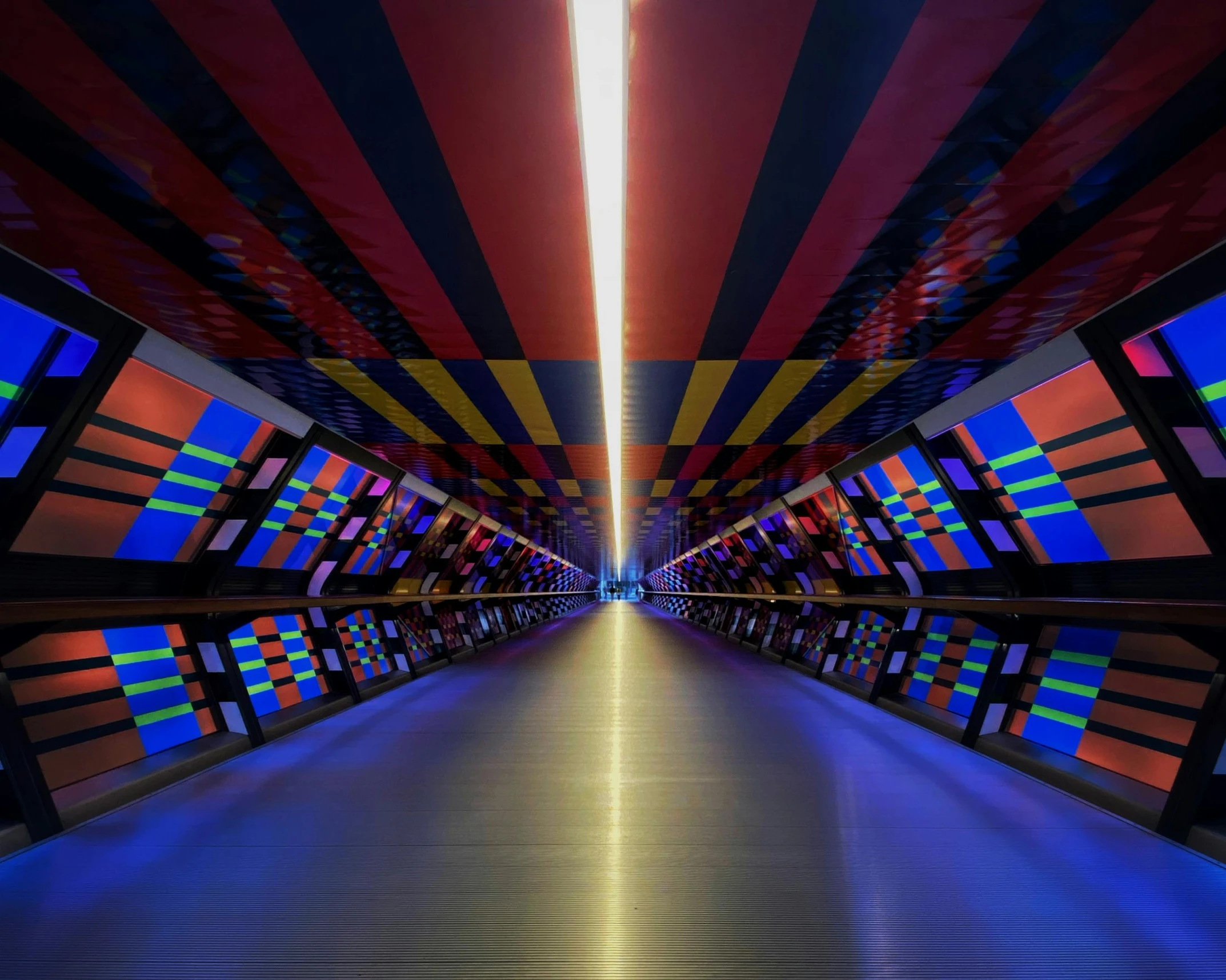 a tunnel filled with lots of colorful lights, an album cover, inspired by Jodorowsky, unsplash contest winner, futurism, in black blue gold and red, demna gvasalia, foster and partners, instagram post