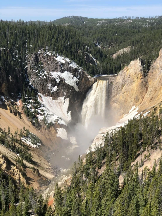 a large waterfall in the middle of a forest, wyoming, slide show, intricate image