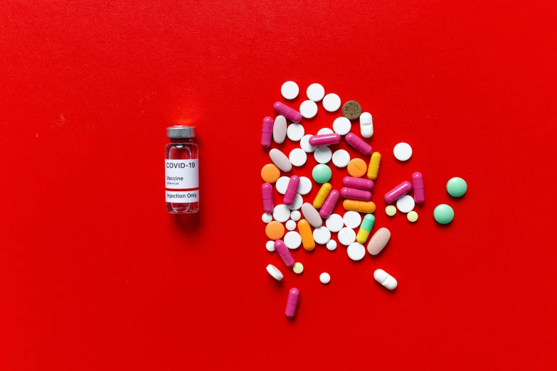 pills and capsules on a red surface, a picture, inspired by Damien Hirst, pexels contest winner, antipodeans, white red, vials, instagram picture, full body in shot