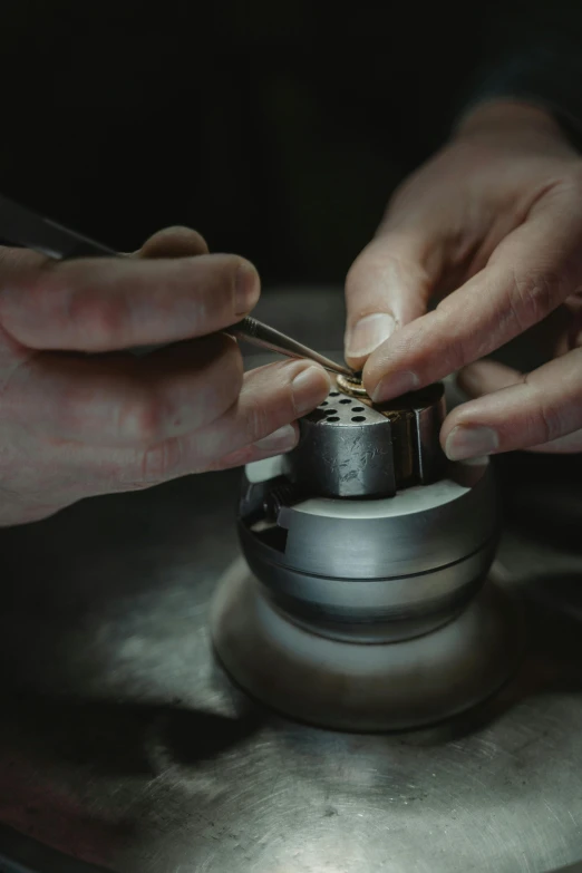 a close up of a person working on a machine, by Matthias Stom, platinum jewellery, thumbnail, high quality image