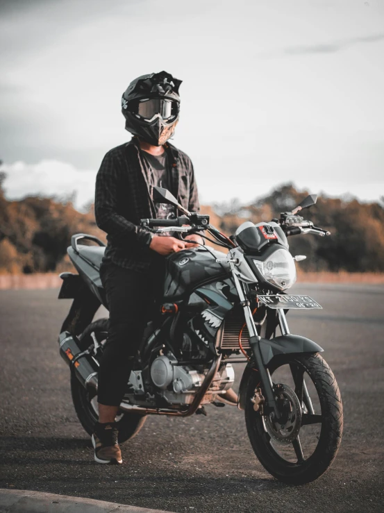 a man wearing a helmet sitting on a motorcycle, a picture, pexels contest winner, avatar image, close full body shot, profile image, no horns