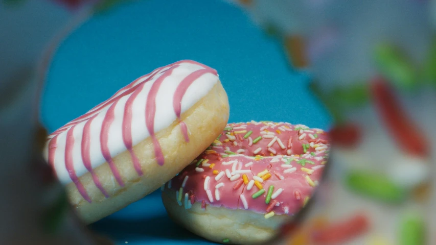 two donuts with pink frosting and sprinkles, pexels, hyperrealism, pink white turquoise, thumbnail, [ cinematic, blurred