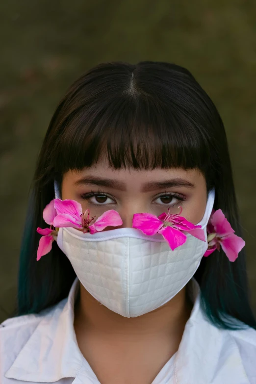 a close up of a person wearing a face mask, an album cover, inspired by Kanō Naizen, floral couture, white and pink, sustainable materials, indonesia