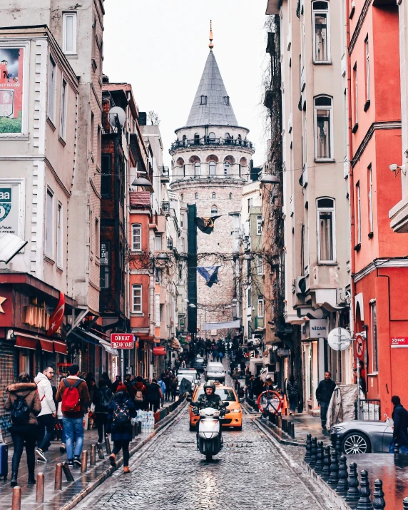 a group of people walking down a street next to tall buildings, by Lucia Peka, pexels contest winner, art nouveau, ottoman sultan, 🚿🗝📝, buildings carved out of stone, slide show