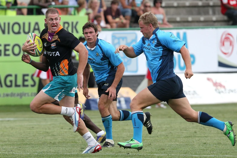 a group of men playing a game of rugby, in a dark teal polo shirt, bram sels, sprinting, jpl