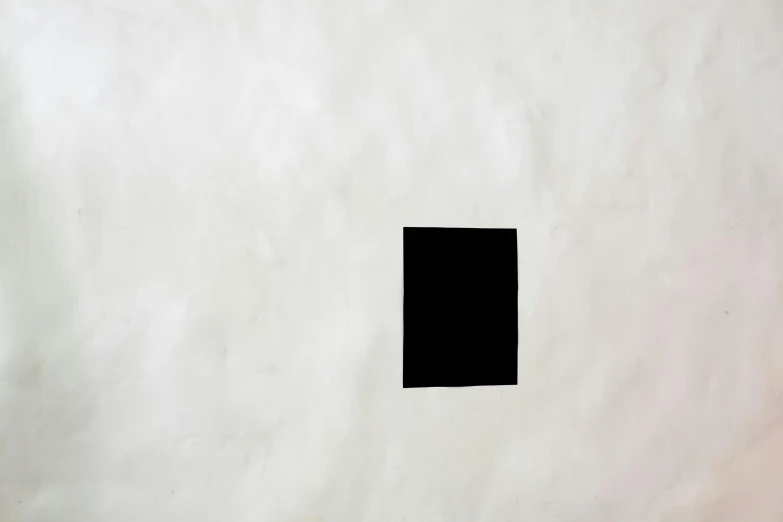 a black square sitting on top of a white sheet of paper, inspired by Malevich, unsplash, 144x144 canvas, keyhole, wall ], portal 3
