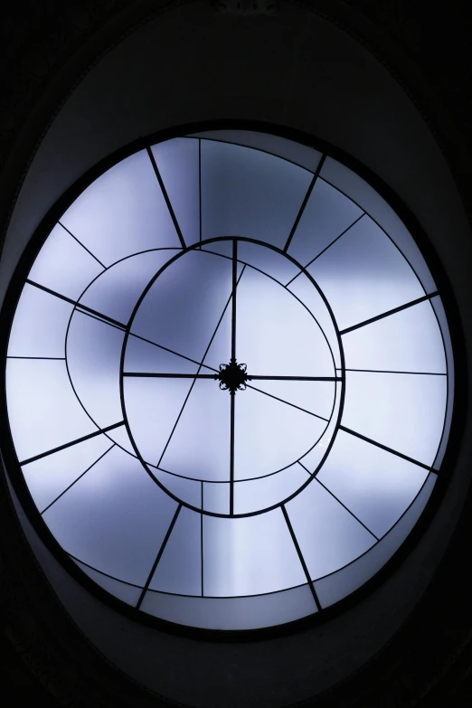 a circular window in the ceiling of a building, by Doug Ohlson, artificial light, dynamic closeup, gothic lighting, up-close