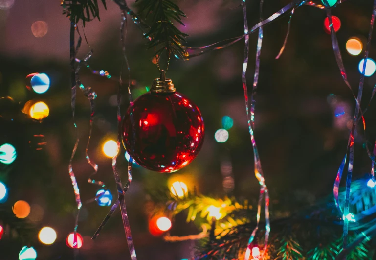 a close up of a christmas ornament on a tree, pexels, party lights, avatar image, wires with lights, thumbnail