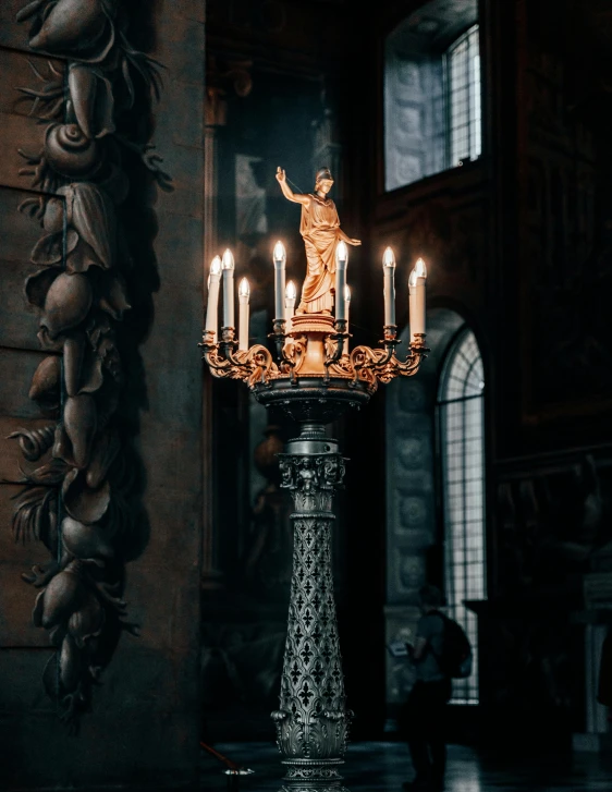 a group of candles sitting on top of a table, a statue, church chandelier, unsplash photo contest winner, royal palace interior, promo image