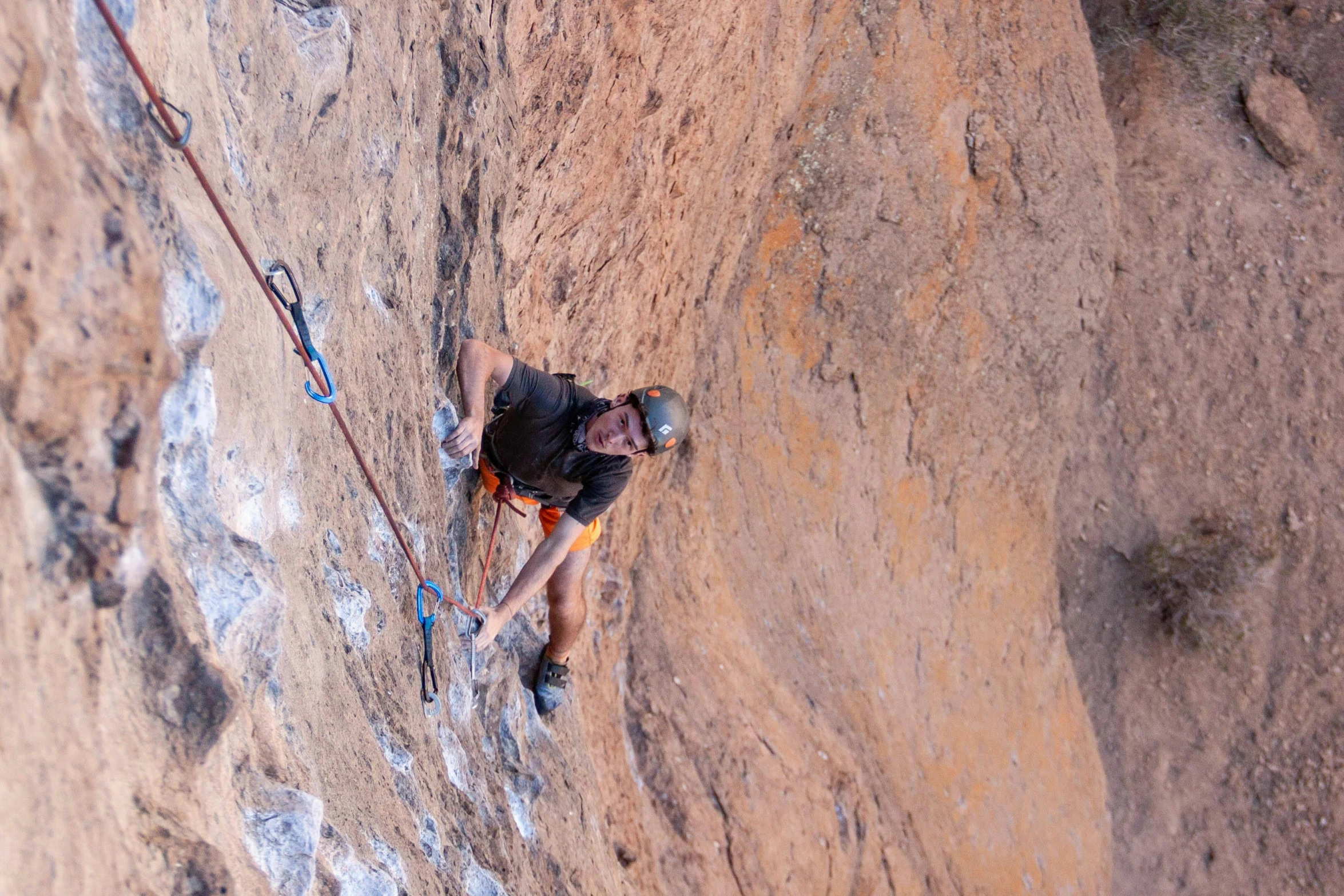 a man climbing up the side of a mountain, a portrait, pexels contest winner, figuration libre, adam ondra, samburu, youtube thumbnail, high angle vertical