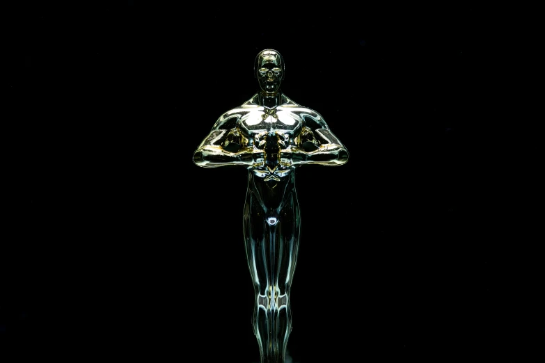 a statue of a man standing in front of a black background, by Joseph Werner, pixabay contest winner, holography, winner of seven oscars, made of liquid metal, isolated on white background, glass skin