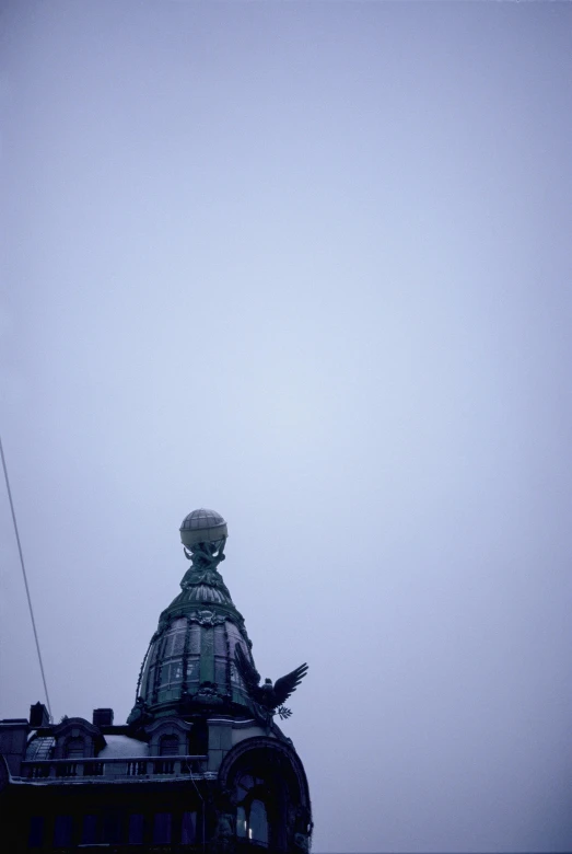 a statue of liberty on top of a building, inspired by Otto Piene, berlin secession, foggy!, dome, low quality photo, capitol hill