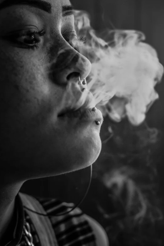 a black and white photo of a woman smoking a cigarette, pexels contest winner, hyperrealism, marijuana smoke, closeup!!!!!!, smoke under the ceiling, headshot profile picture