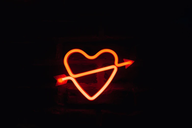 a neon heart with an arrow in the middle of it, a picture, by Emma Andijewska, pexels, neon standup bar, reddish, 6, rustic