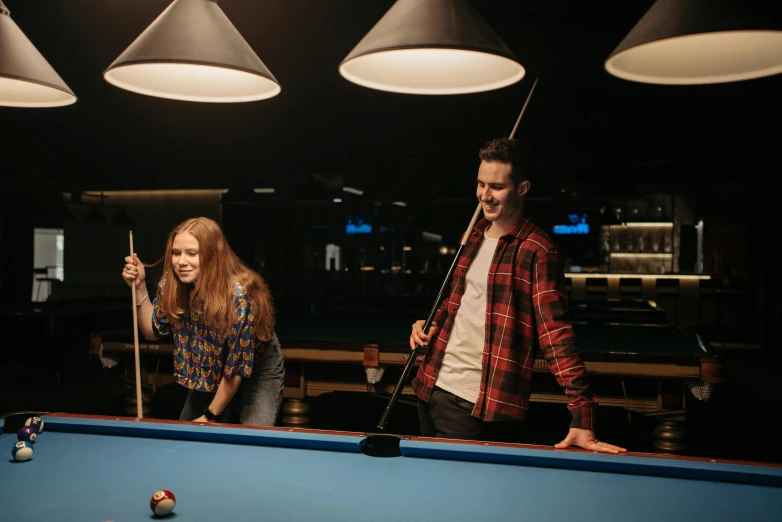 a man and a woman playing a game of pool, pexels contest winner, ambience lighting, teenager hangout spot, thumbnail, enhanced