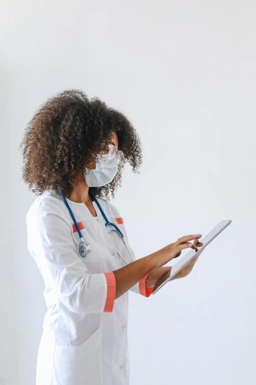 a woman in a white lab coat holding a tablet, pexels, happening, ashteroth, masked person in corner, medical reference, afro tech