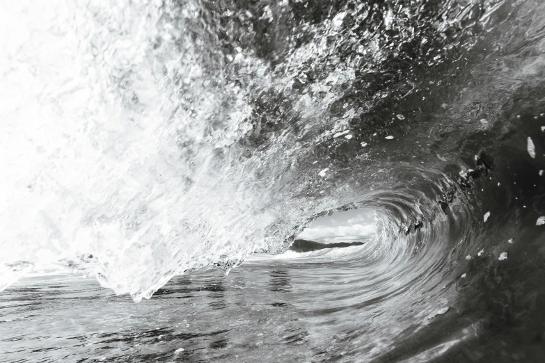 a man riding a wave on top of a surfboard, a black and white photo, unsplash contest winner, photorealism, inside the curl of a wave, detailed photo of an album cover, water pipe, crystal clear