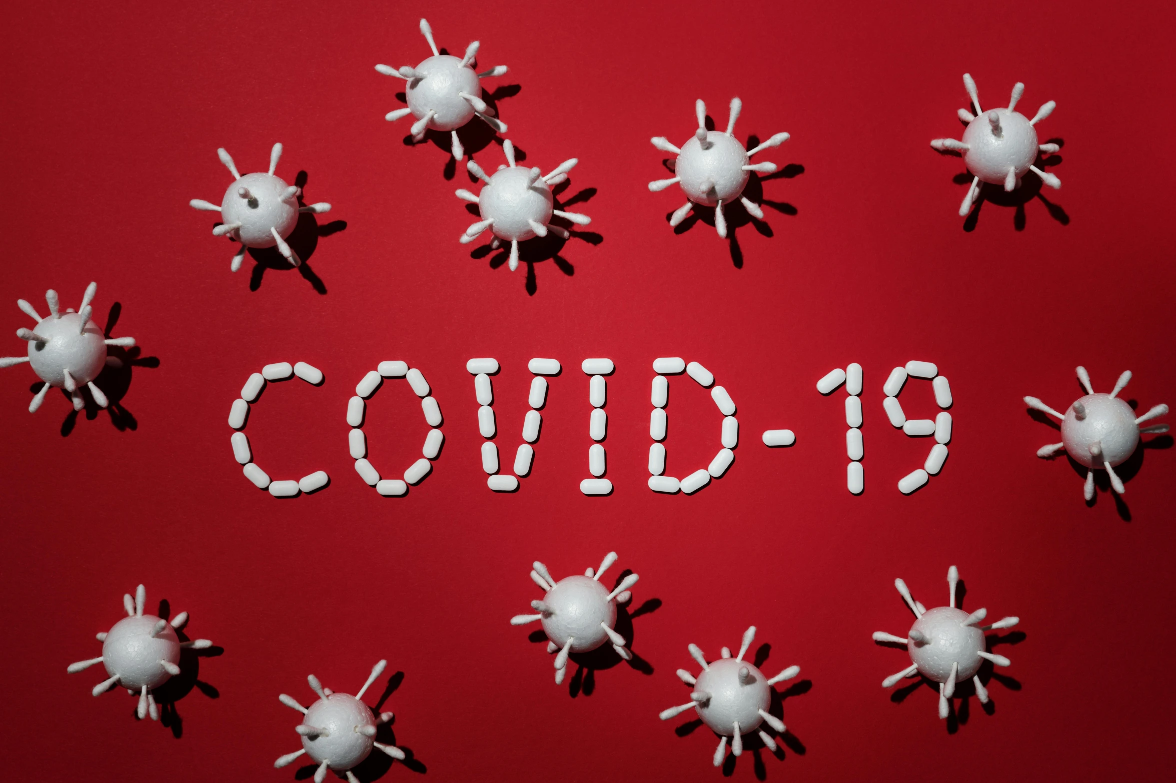 the word covidid spelled out of pills on a red background, an album cover, shutterstock, graffiti, 1 6 x 1 6, masks, holiday season, 19xx