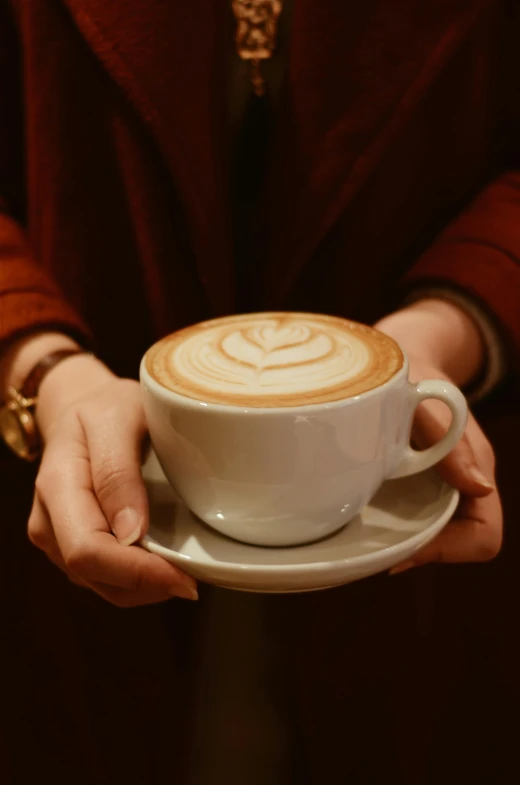 a close up of a person holding a cup of coffee, award-winning crisp details”, lena oxton, cappuccino, thumbnail