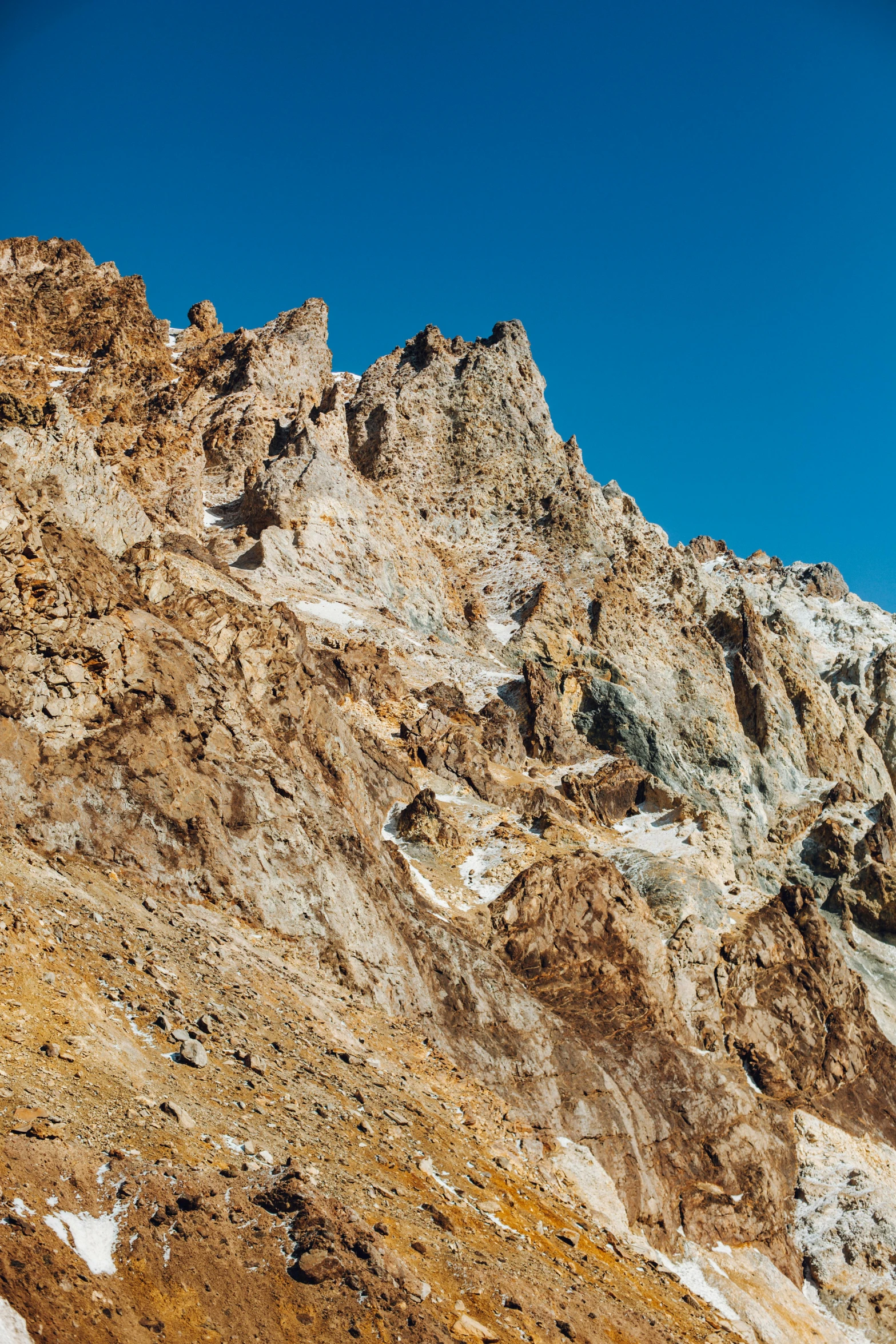 a man riding a snowboard up the side of a mountain, by Carlo Martini, les nabis, ochre ancient palette, panorama, larapi, tall spires