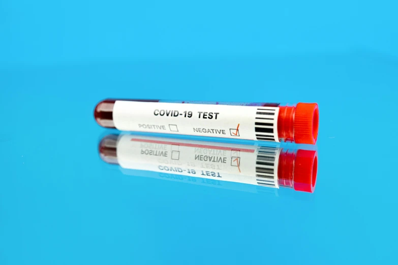 two test tubes sitting next to each other on a blue surface, a picture, shutterstock, coronavirus, square, red color bleed, 1 9 th