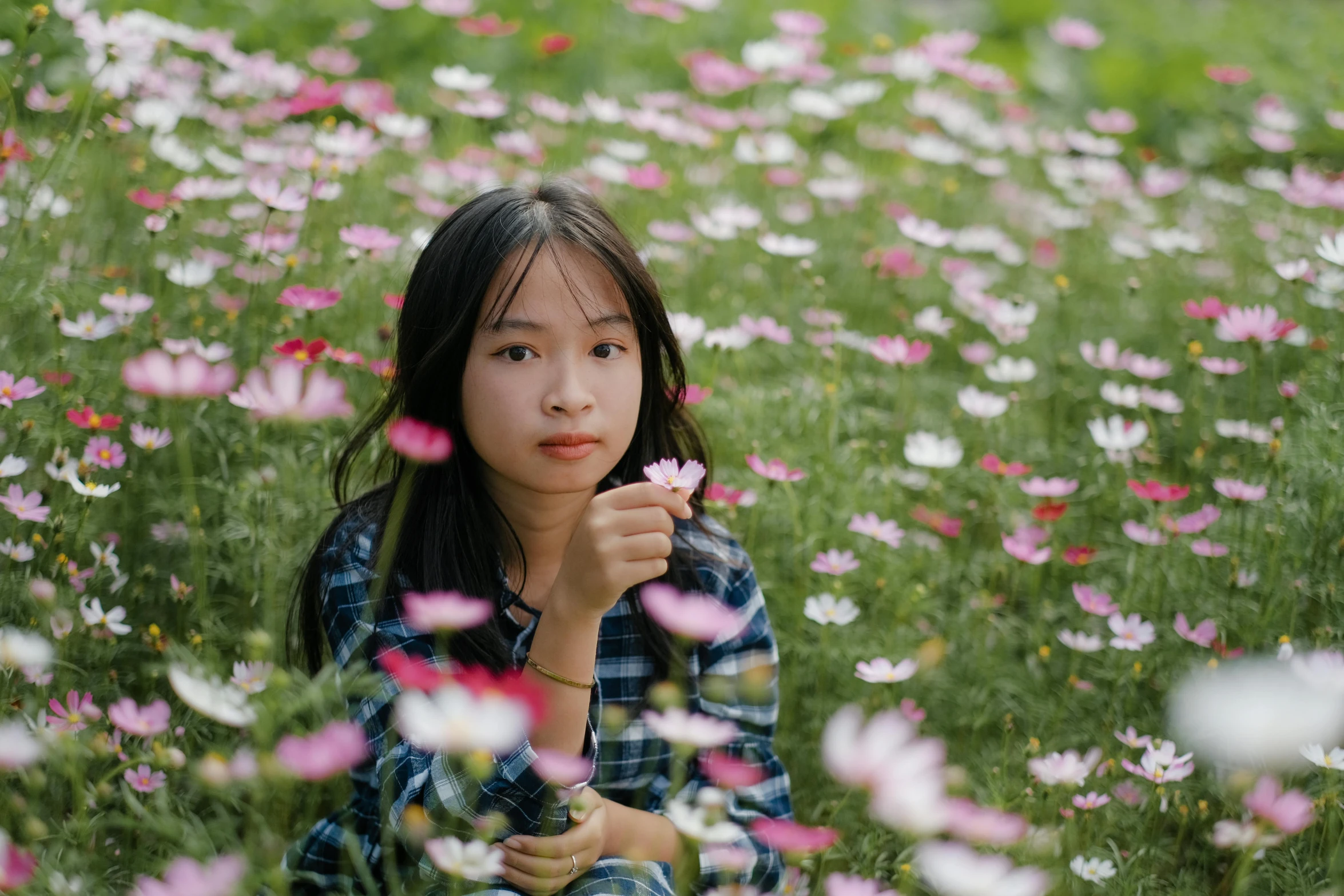 a woman sitting in a field of flowers, by Shang Xi, pexels contest winner, portrait of a young teenage girl, miniature cosmos, avatar image, 2 0 2 2 photo