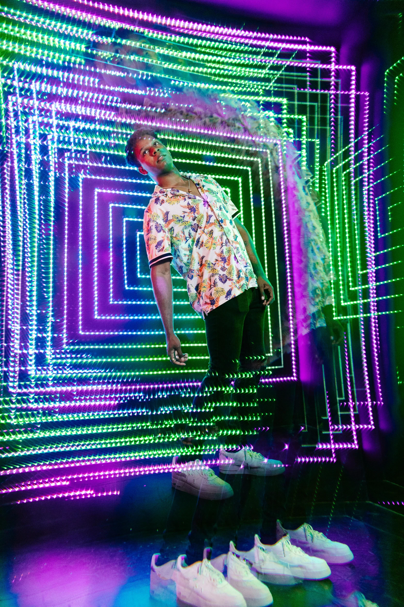 a man that is standing in front of some lights, inspired by David LaChapelle, holography, patterned clothing, teddy fresh, max headroom, bay area