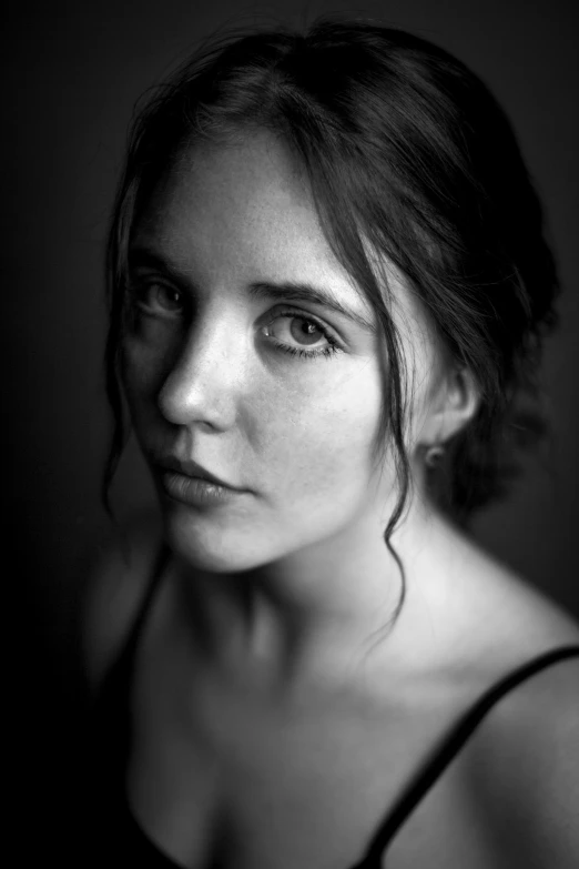 a black and white photo of a woman, unsplash contest winner, photorealism, studio medium format photograph, serious focussed look, 85mm nd 5, elizabeth olsen