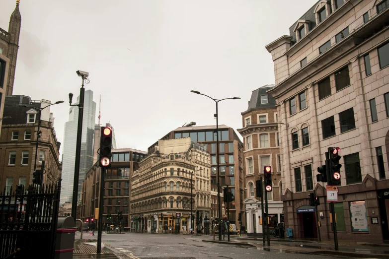 a city street filled with lots of tall buildings, a photo, on a wet london street, grey sky, fan favorite, square