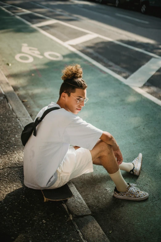 a young man sitting on the side of a road, by Cosmo Alexander, trending on pexels, realism, tan skin a tee shirt and shorts, wearing basketball jersey, non binary model, curls on top