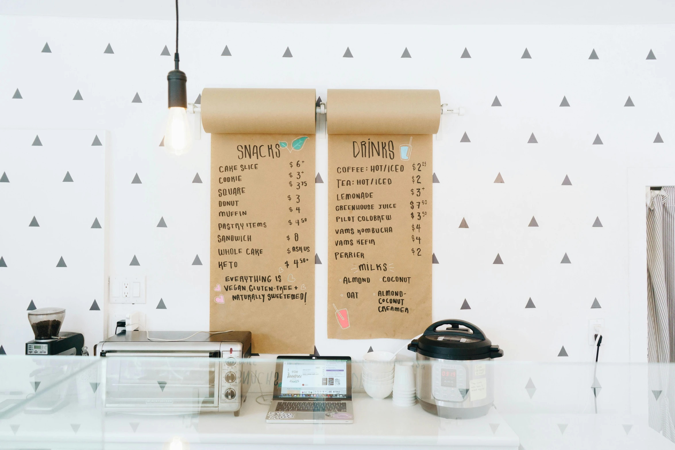 a table that has a menu on it, trending on unsplash, wallpaper on the walls, cute bakery shop, 9 9 designs, simplistic design