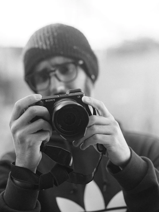 a man taking a picture with a camera, a black and white photo, sony a7z, felix englund style, zoomed in, sony a 6 3 0 0