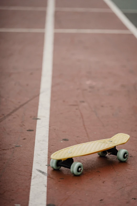 a skateboard sitting on top of a tennis court, by Tom Bonson, square, corduroy, 15081959 21121991 01012000 4k, on a racetrack