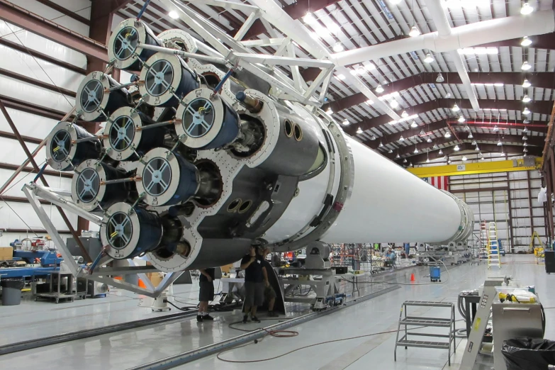 a large jet sitting inside of a hangar, reddit, renaissance, big booster rocket engines, spacex, inside a crowded space station, seen from the side