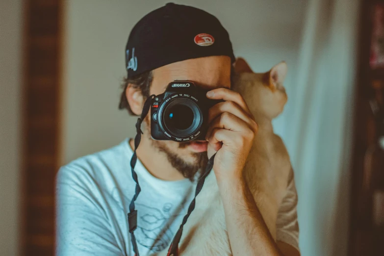 a man taking a picture of a cat with a camera, a picture, pexels contest winner, avatar image, headshot profile picture, mid shot photo, clean image